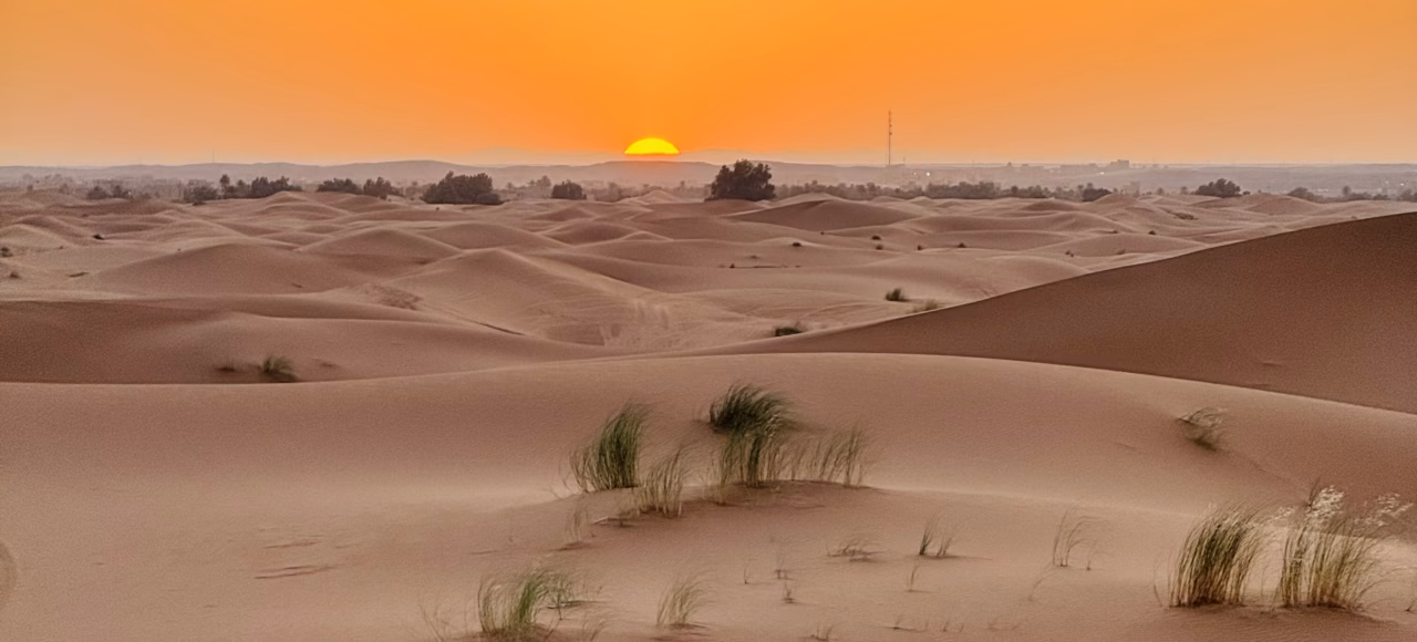sunset in the desert for 3 days from fes 3 days desert tour from Fes to Merzouga