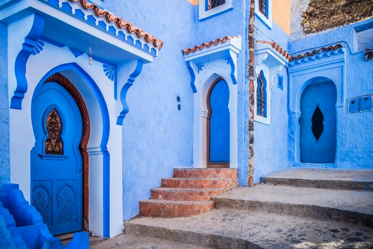 Blue-painted street and doors in Chefchaouen's medina