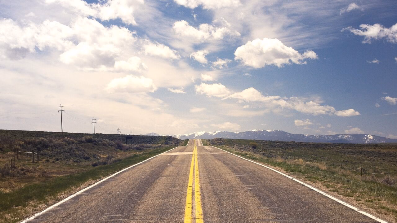 Open road representing travel to Morocco from North America